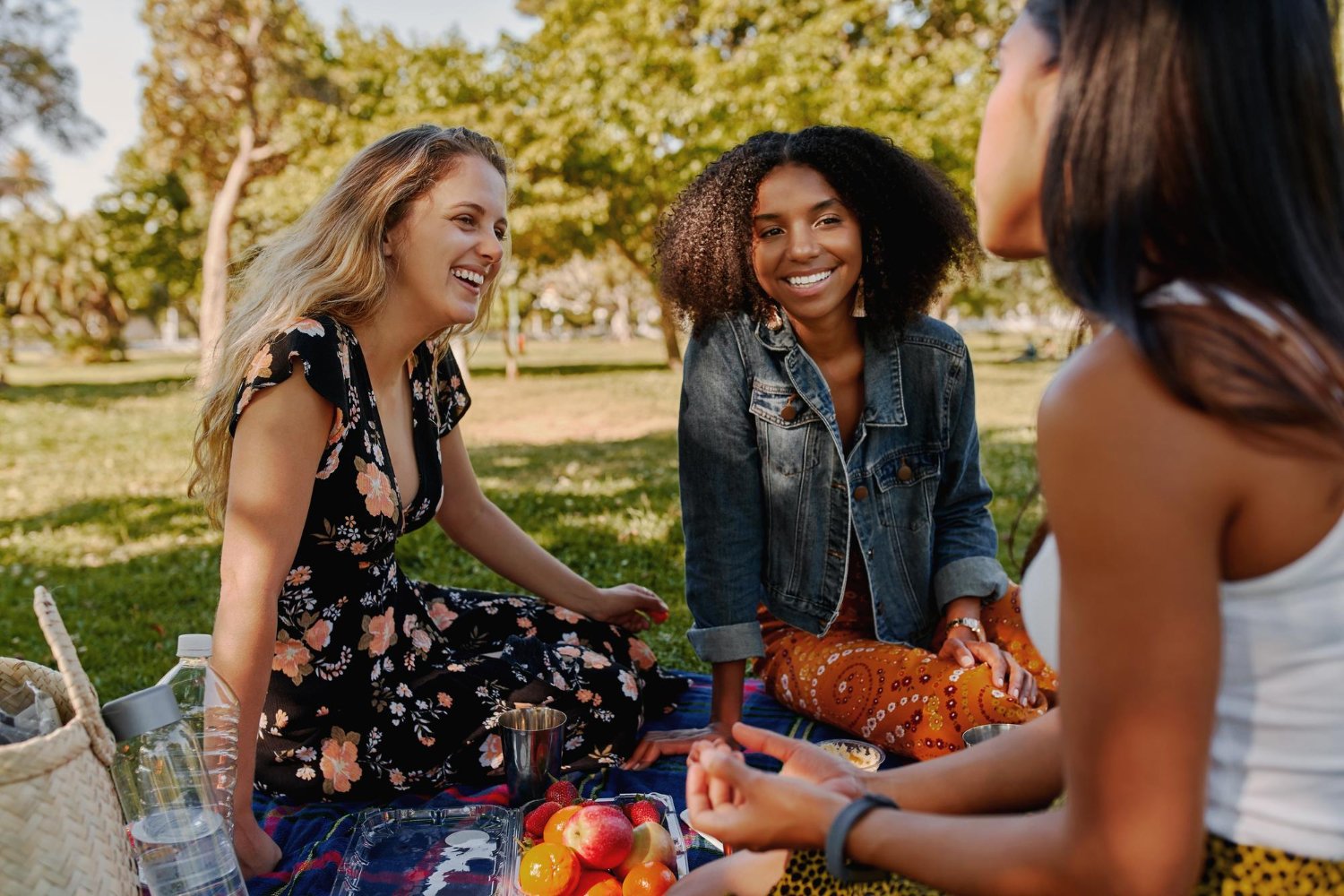 Friends gathered and laughing together at an outdoor gathering